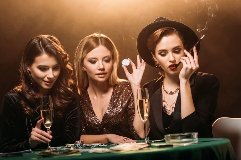 Multilingual dealer at Lucky Twins table communicating with players